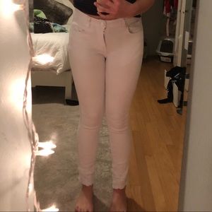 white jeans with floral detail on bottom